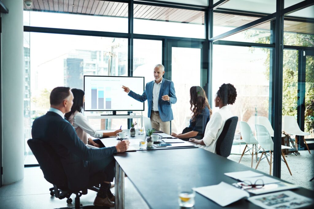 CEO leading a discussion on scaling AI across the organization.
