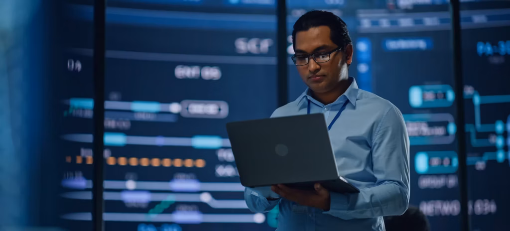 Data scientist reviewing AI-driven insights from raw data for business decision-making.